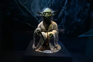 A life-size figurine of Yoda from the Star Wars series