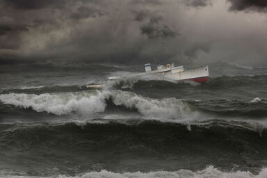 Ship on stormy ocean waves