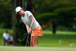 Sarah Schmelzel wears a golf t-shirt