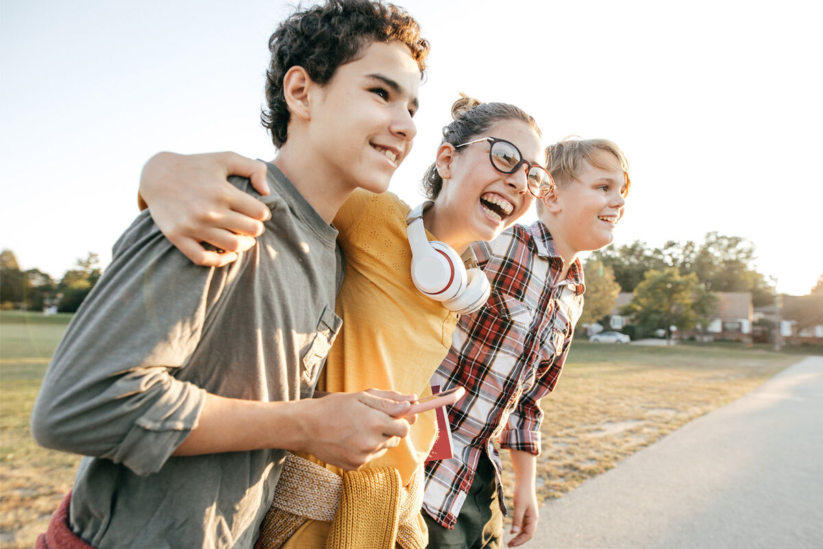 three teen Zoomer friends having fun after school