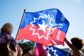 People carry a Juneteenth flag
