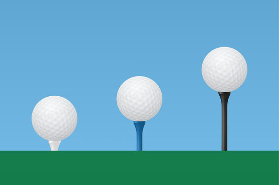golf tees with balls at different heights