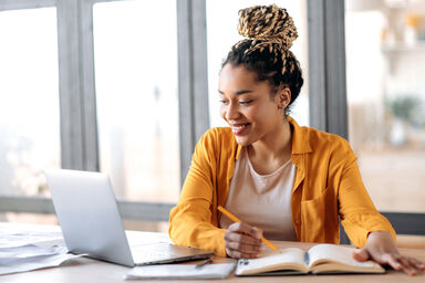 Woman studying using a laptop