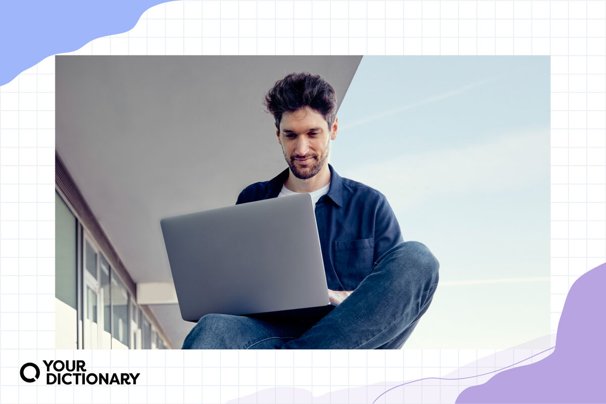 A man typing on a laptop.