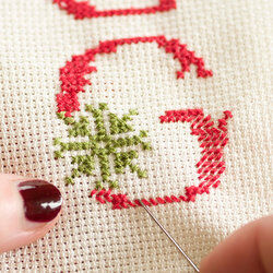 Cross stitching the letter G