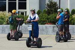 Tourists riding Segway personal transporters