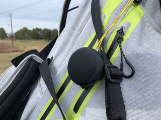 Team8 S golf Bluetooth speaker clipped to a golf bag