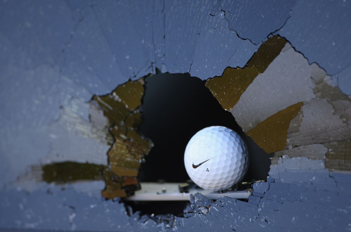 Errant golf shot breaks a window
