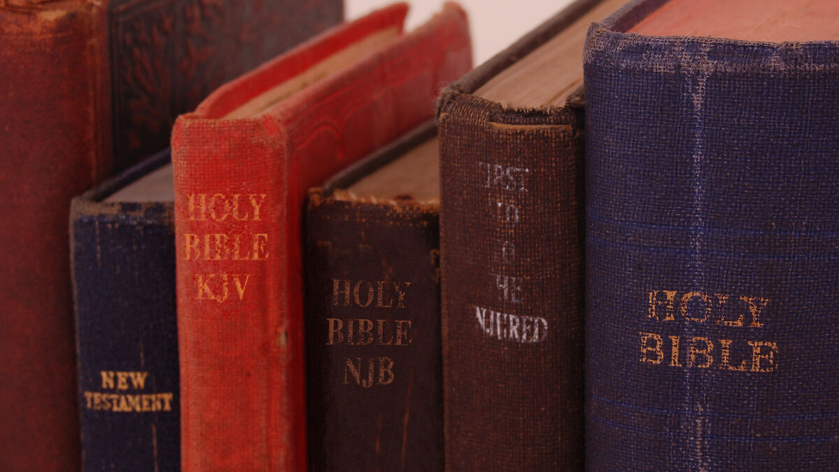 Multiple bibles on a shelf