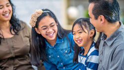 Filipino family laughing together