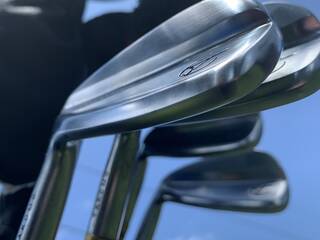 Takomo Golf irons against blue sky