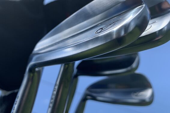 Takomo Golf irons against blue sky