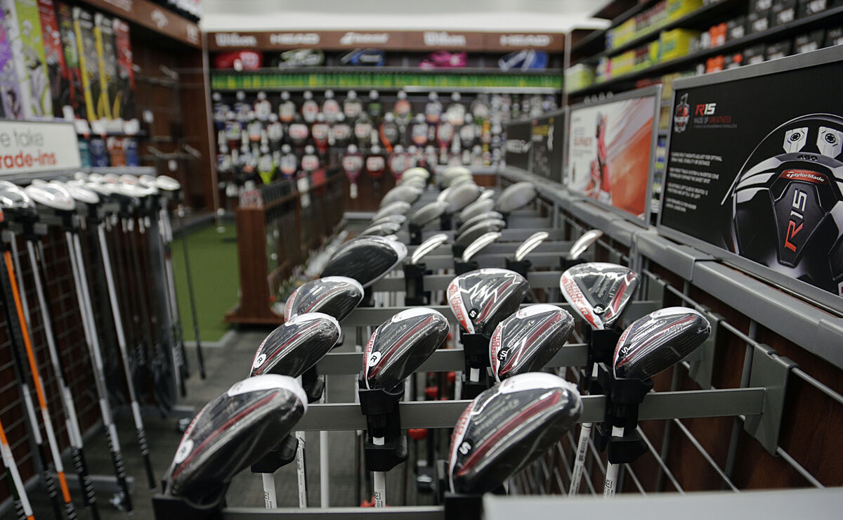 Golf clubs on a rack at a golf shop