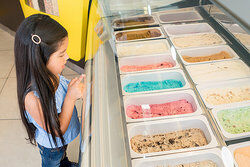 The girl always chooses the same flavor of ice cream.