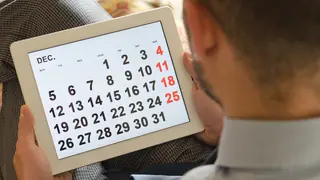 Man holding tablet with calendar image