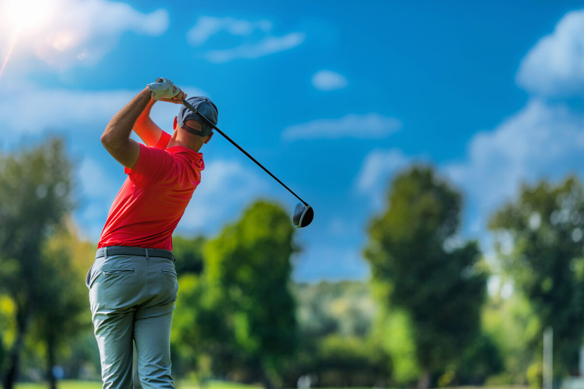 Golfer holding his finish