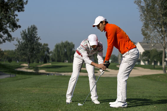 Golfer learning perfect posture and set up