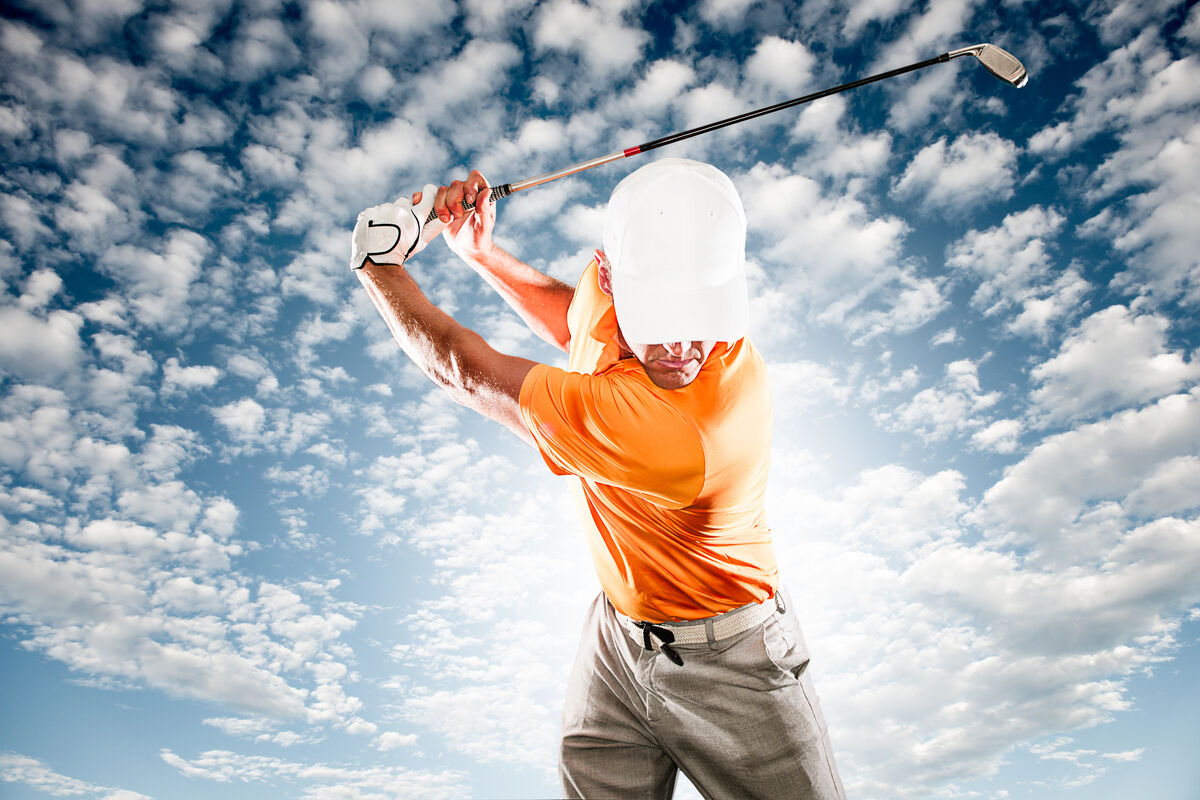 Golfer at the top of his backswing