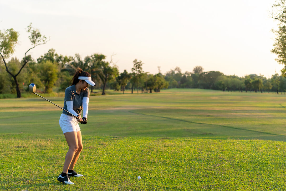 Woman golfer works on her swing path