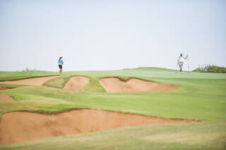 Golfer hitting bump and run shot