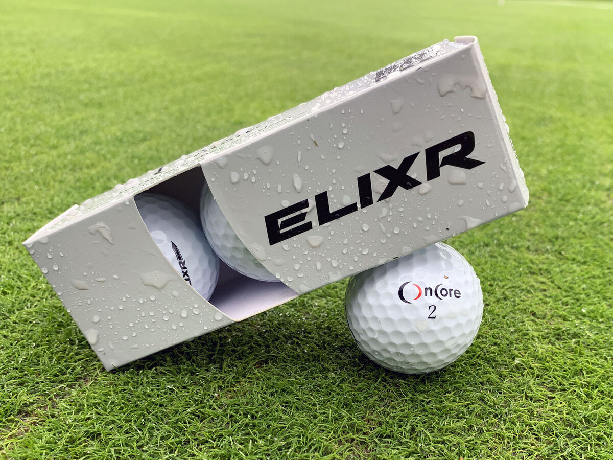 OnCore ELIXR golf ball and sleeve on a putting green