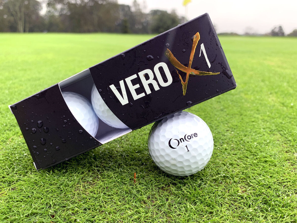 Sleeve of OnCore VERO X1 golf balls resting on a ball on the putting green