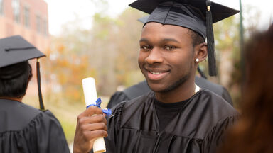 black male college student with diploma