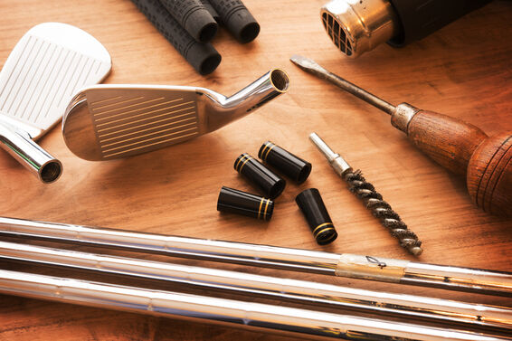 Golf club components on a club-builder's work bench