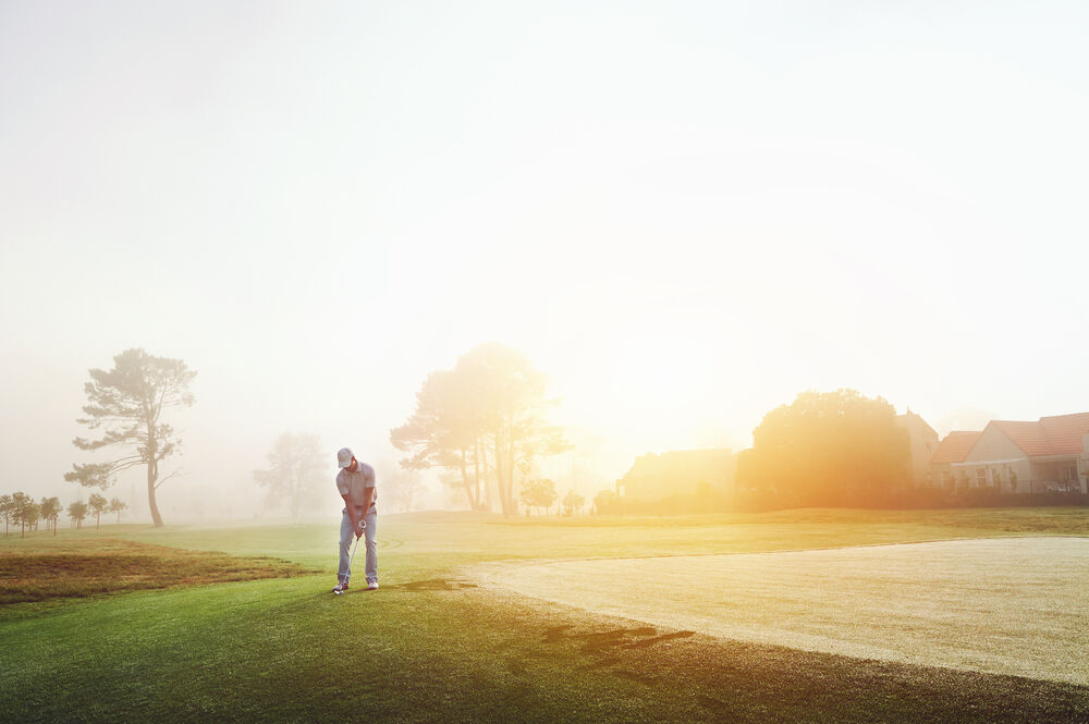 Golfer playing early in the morning