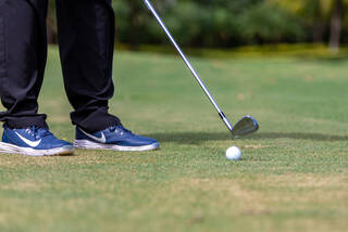 Golfer getting ready to hit an iron shot