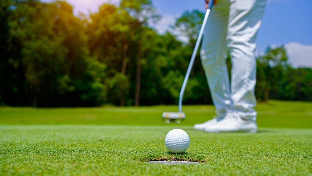 Golfer making a putt