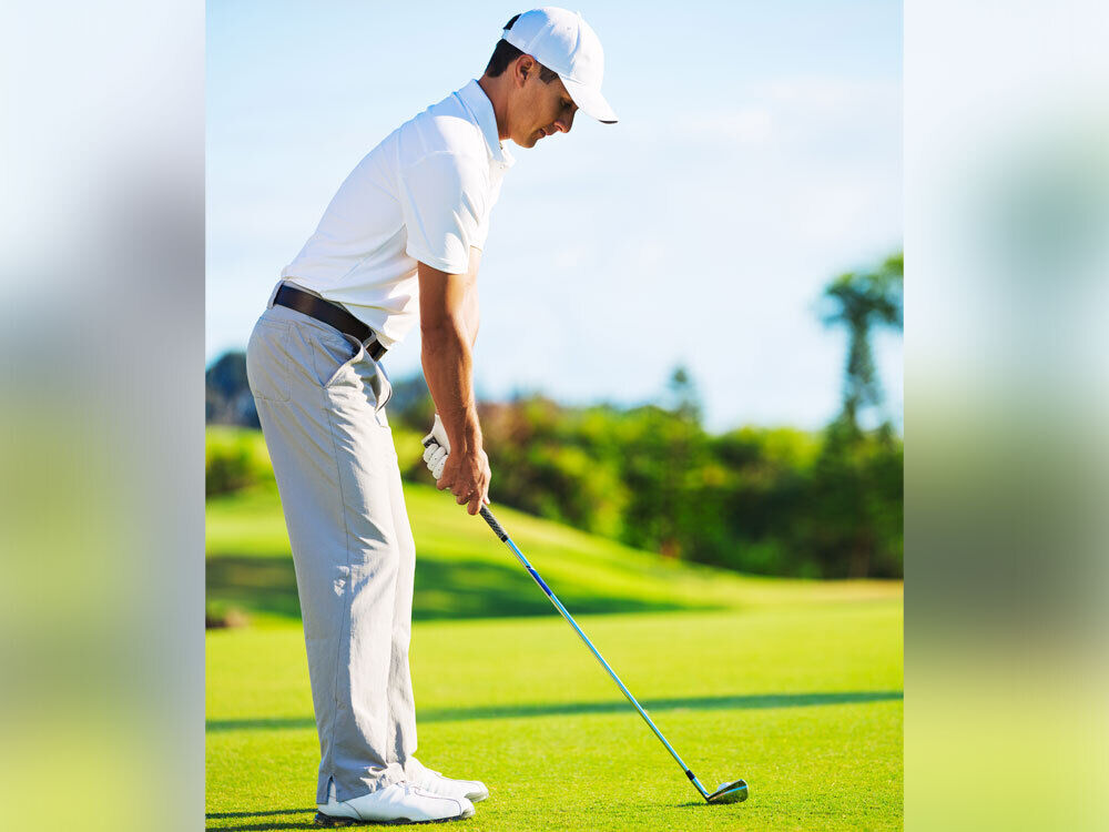 Man in the proper golf setup