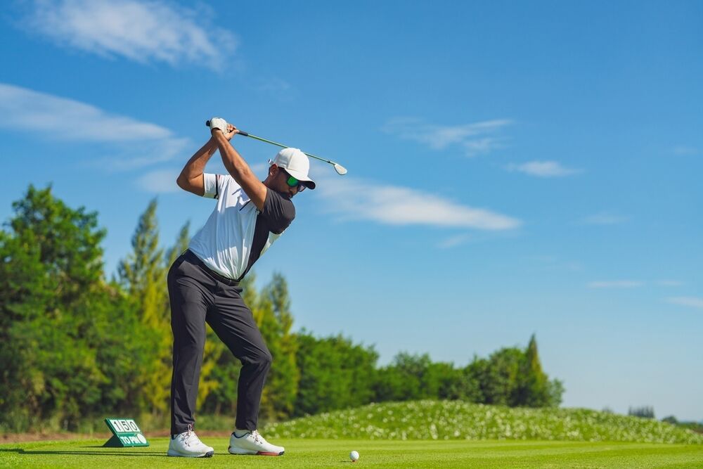 Golfer in perfect position at the top of the backswing