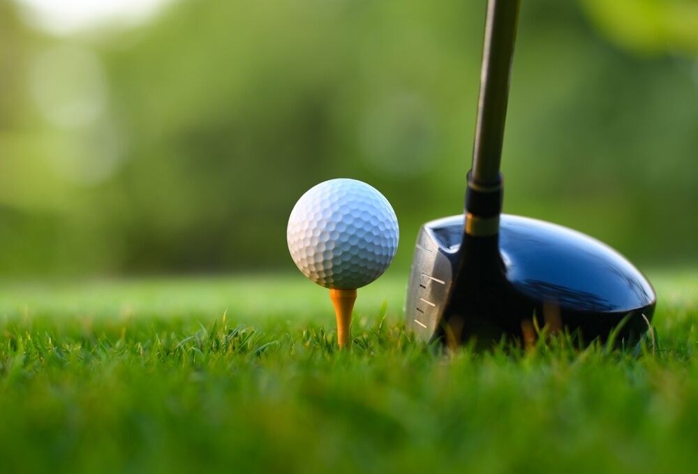 golf ball hit by driver close up