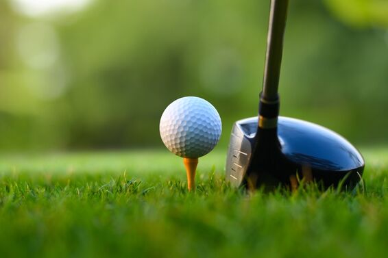 golf ball hit by driver close up