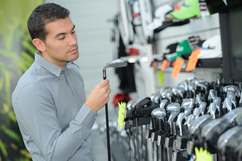 Golfer shopping new golf clubs