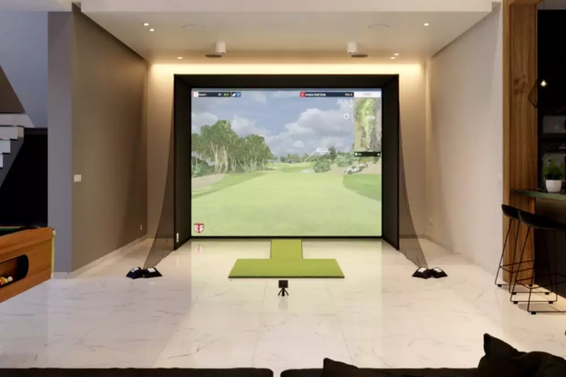 Golf room with a home golf simulator