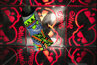 SWAG Golf putter head and headcover in a display case