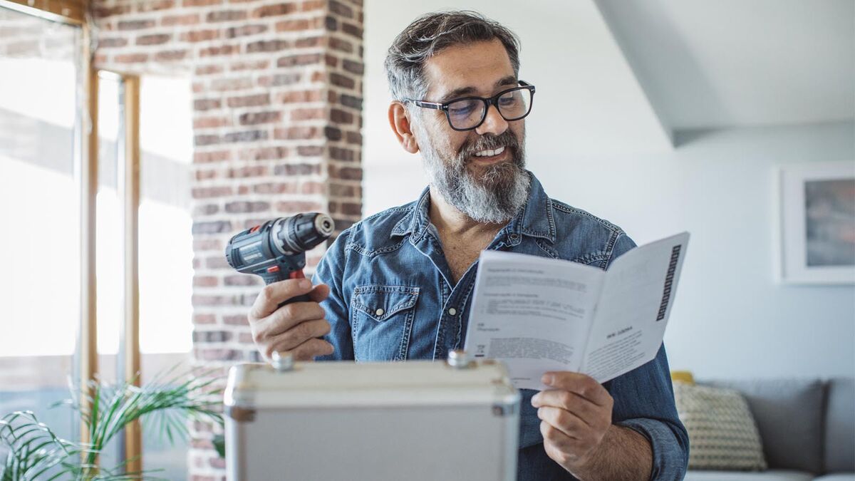 man reading technical user manual