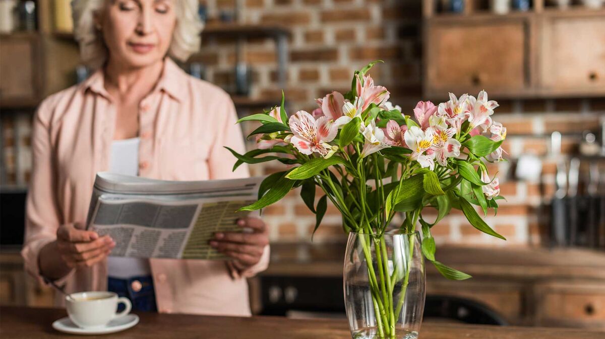 woman reading obituary