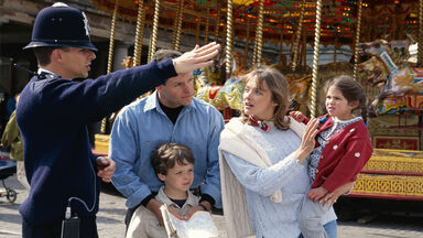 British police officer directing family
