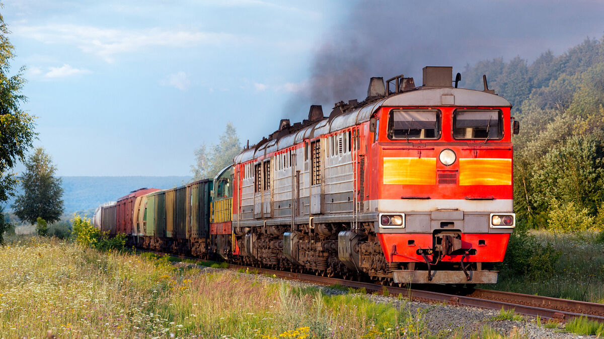 railroad track with locomotive hauling freight