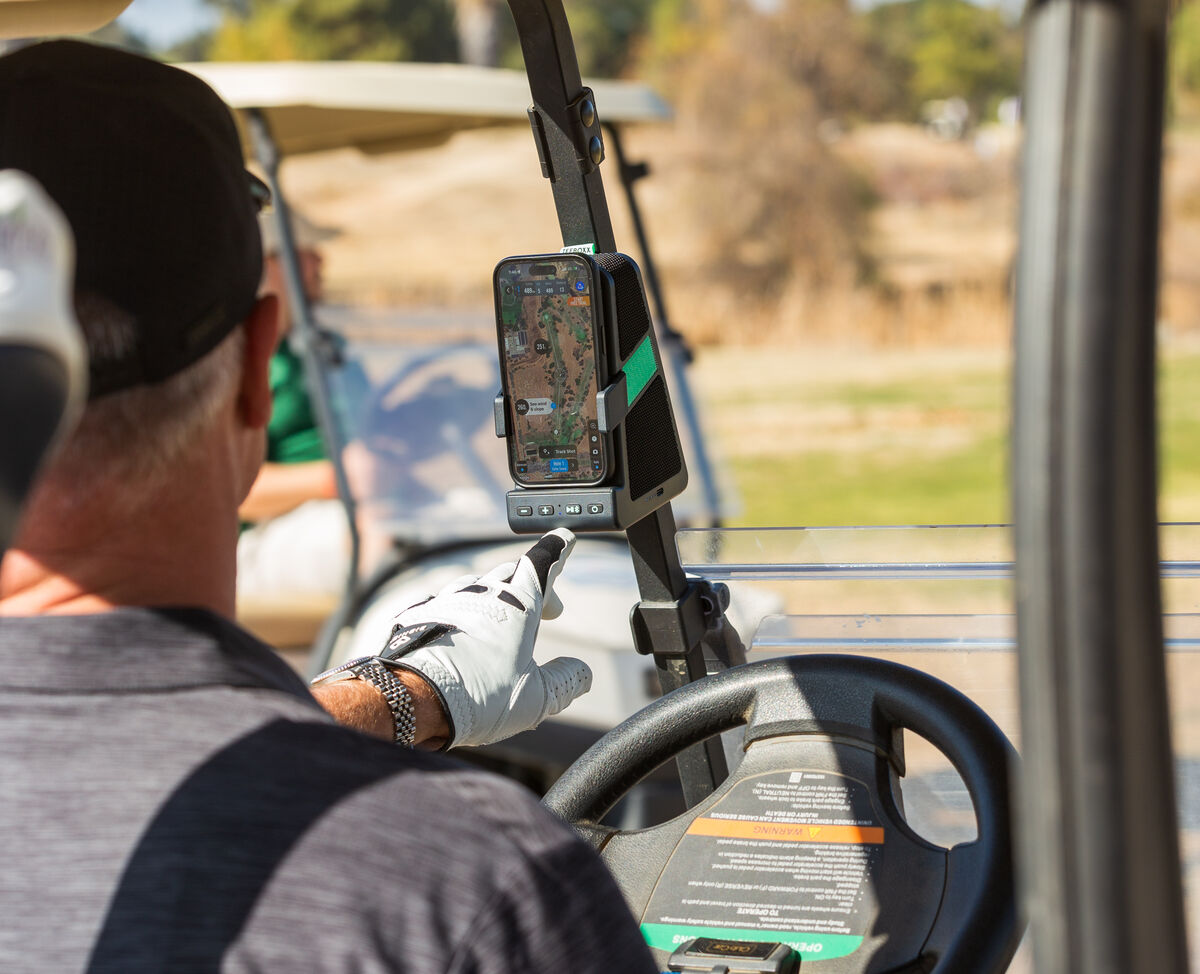 Golfer uses TeeBoxx to keep phone charged while using GPS maps and playing music
