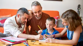 gay parents playing game with kids