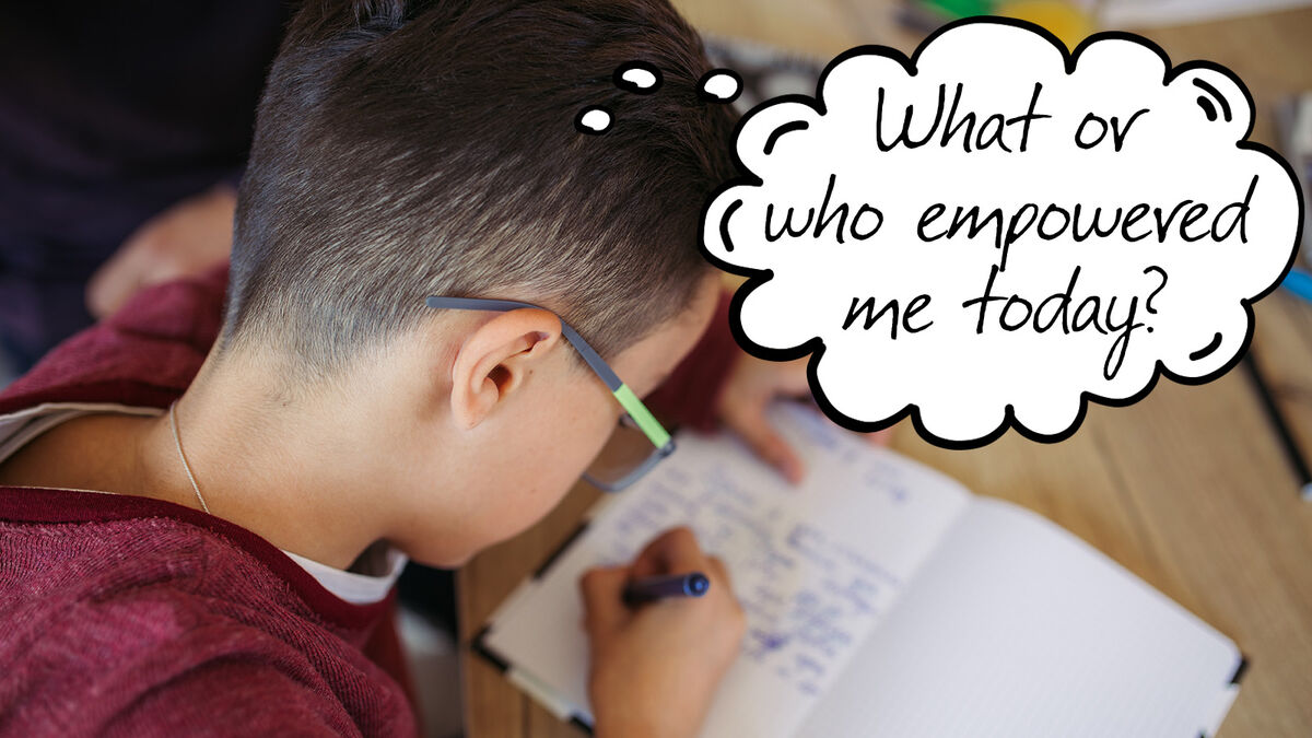 Boy writing journal using prompt