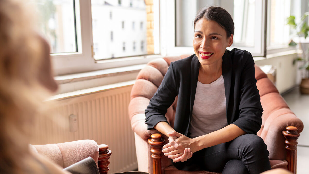 Woman seated in an interview