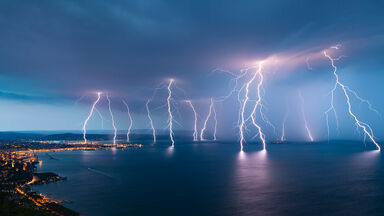 lightning storm over water lightning storm over water
