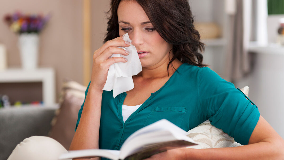 woman reading cathartic book