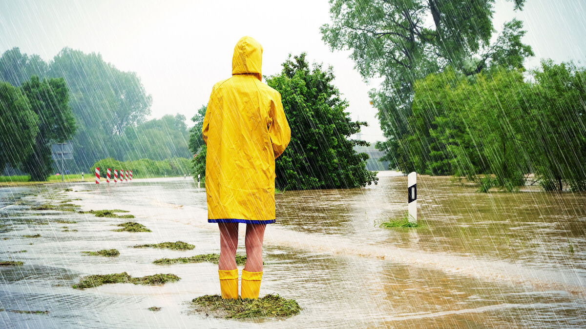 person standing in the rain