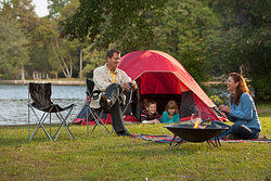 Family camping with a tent as examples of hindsight bias